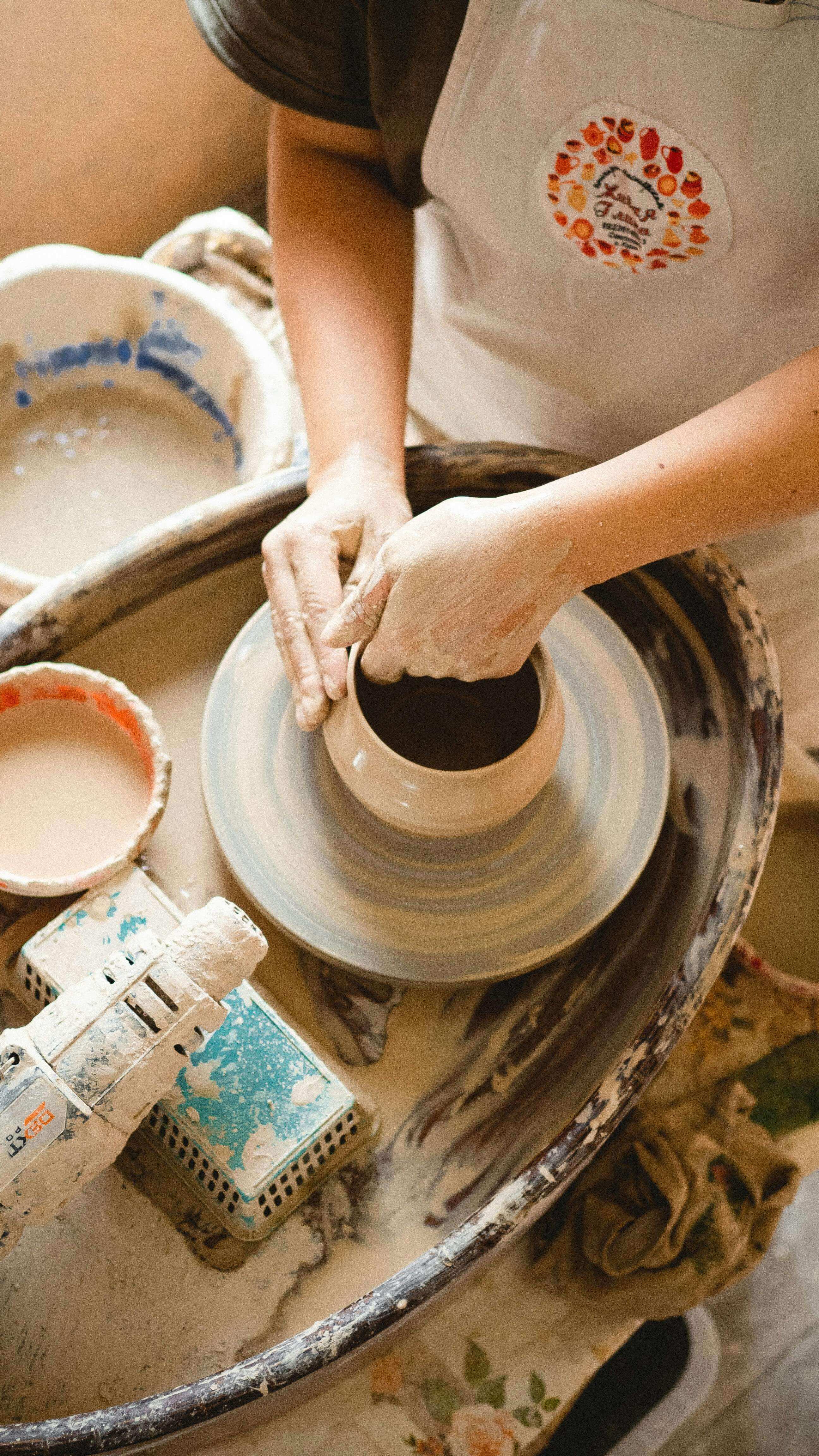 Variety of Chascent handmade products, including ceramic cups and woven baskets, arranged artistically to highlight their natural aesthetic.